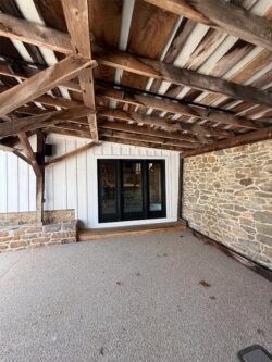 The Barns at Crest Hill Fireplace Patio covered area facing main barn