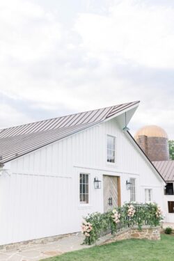 The Barns at Crest Hill Main Climate-Controlled Barn Wedding front door decorated