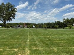 The Barns at Crest Hill Open Acreage facing driveway and Barns
